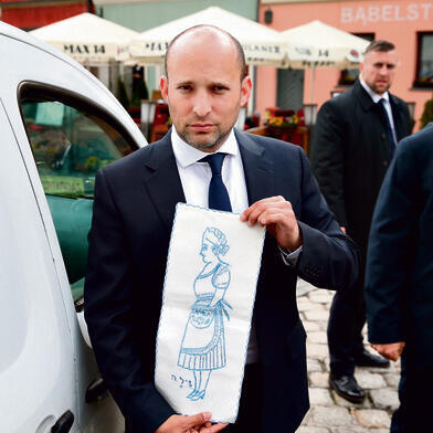 Bennett posing with the family heirloom in Polandnullnull Bennett posing with the family heirloom in Poland