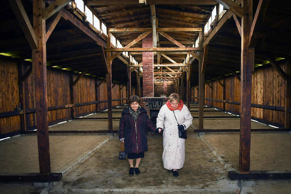 Auschwitz-Birkenau survivors Bronia Brandman (L) and Giselle ‘Gita’ Cycowicz at a Birkenau hut in which both were forced to sleep during the Holocaust (Photo: Shahar Azran) (Photo: Shahar Azran) Auschwitz-Birkenau survivors Bronia Brandman (L) and Giselle ‘Gita’ Cycowicz at a Birkenau hut in which both were forced to sleep during the Holocaust (Photo: Shahar Azran)