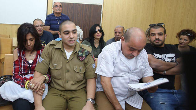 Elor Azaria in court with his parents to appeal his conviction (Photo: Motti Kimchi)