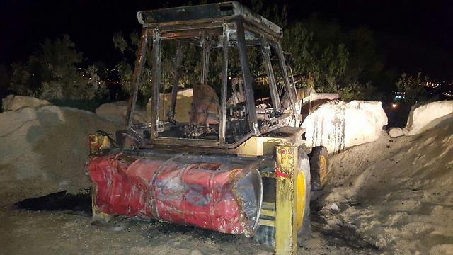 Incinerated tractor (Photo: Zacharia Sadeh)
