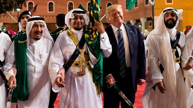 Trump in Riyadh. We’ll do the sword dance around you and add a huge check for the arms deals, and you’ll create an anti-Shiite, anti-Iranian axis (Photo: AFP) (צילום: AFP) Trump in Riyadh. We’ll do the sword dance around you and add a huge check for the arms deals, and you’ll create an anti-Shiite, anti-Iranian axis (Photo: AFP)