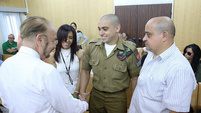 Azaria with his parents and his attorney, left (Photo: Motti Kimchi)