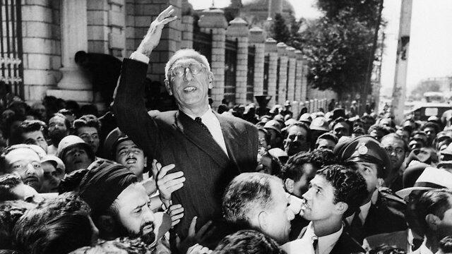 Prime Minister Mohammed Mosaddegh rides on the shoulders of cheering crowds in Tehran’s Majlis Square, 1953 (Photo: AP) (Photo: AP) Prime Minister Mohammed Mosaddegh rides on the shoulders of cheering crowds in Tehran’s Majlis Square, 1953 (Photo: AP)