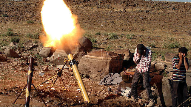 Syrian rebel fire (Photo: Reuters)