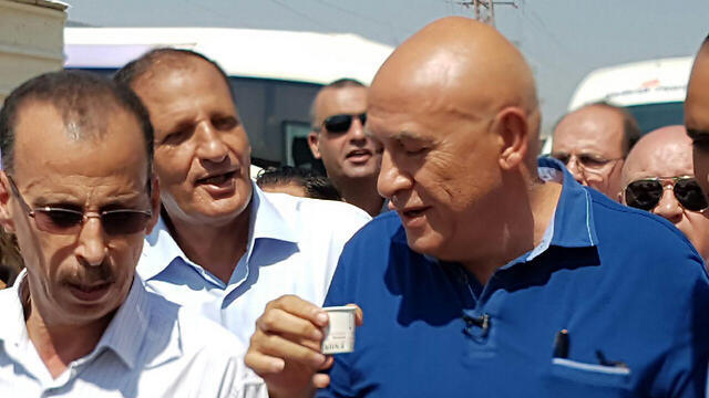 Ghattas with supporters on his way to prison.