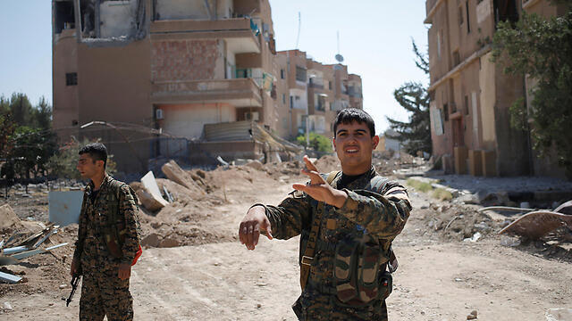 Kurdish fighters in the Syrian city of Raqa, after helping to drive out Islamic State (Photo: Reuters)