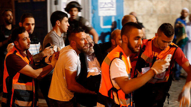 Former Grand Mufti Ekrima Sa'id Sabri after purportedly being injured in clashes (Photo: AFP)