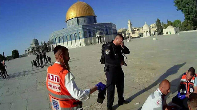 A police officer crying following the attack on the Temple Mount.