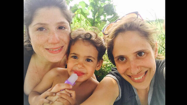 Brit (L) and Adi, in a picture with their eldest child, from Adi's Facebook postnullnull Brit (L) and Adi, in a picture with their eldest child, from Adi's Facebook post