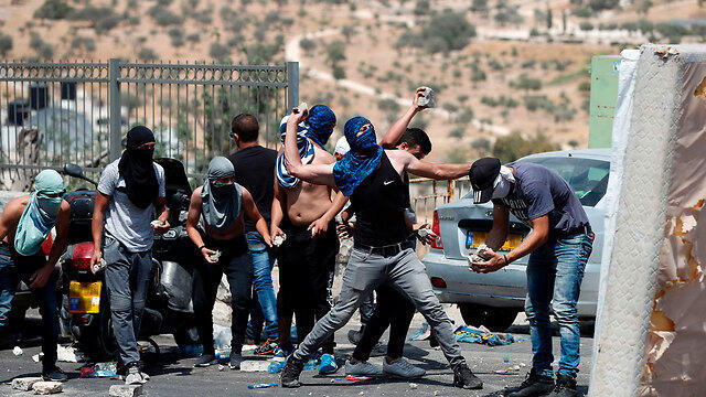 Rioters outside the Temple Mount (Photo: AFP)