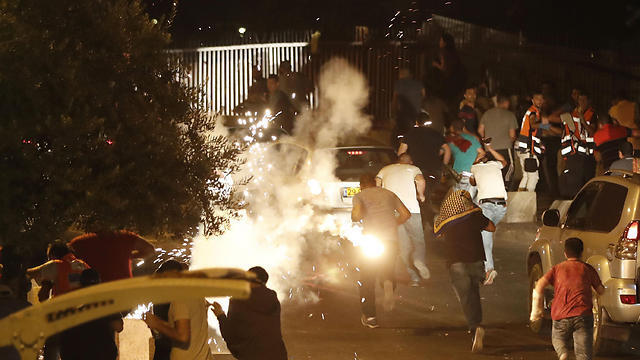 Protestors clashing with police (Photo: AFP)