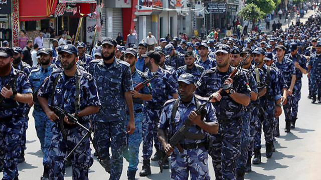 Hamas militants marching in Gaza (Photo: AP)