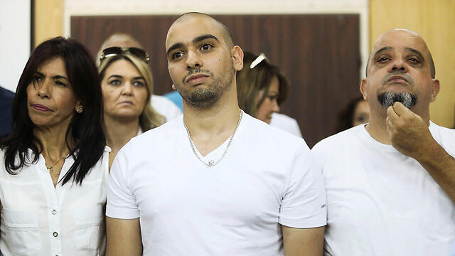 Elor Azaria with his parents in court Sunday (Photo: Reuters)