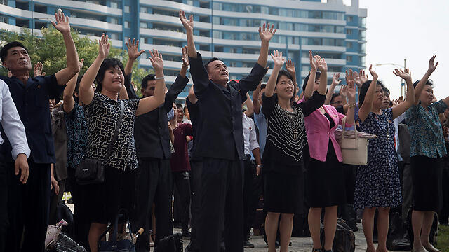 Радость в Пхеньяне. Фото: AFP (צילום: AFP) Радость в Пхеньяне. Фото: AFP