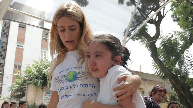 Volunteers never lost their cool, consoling children and moving them out of the school (Photo: Heroes for Life)