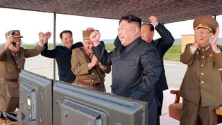 North Korean leader Kim Jong Un watches a test missile launch