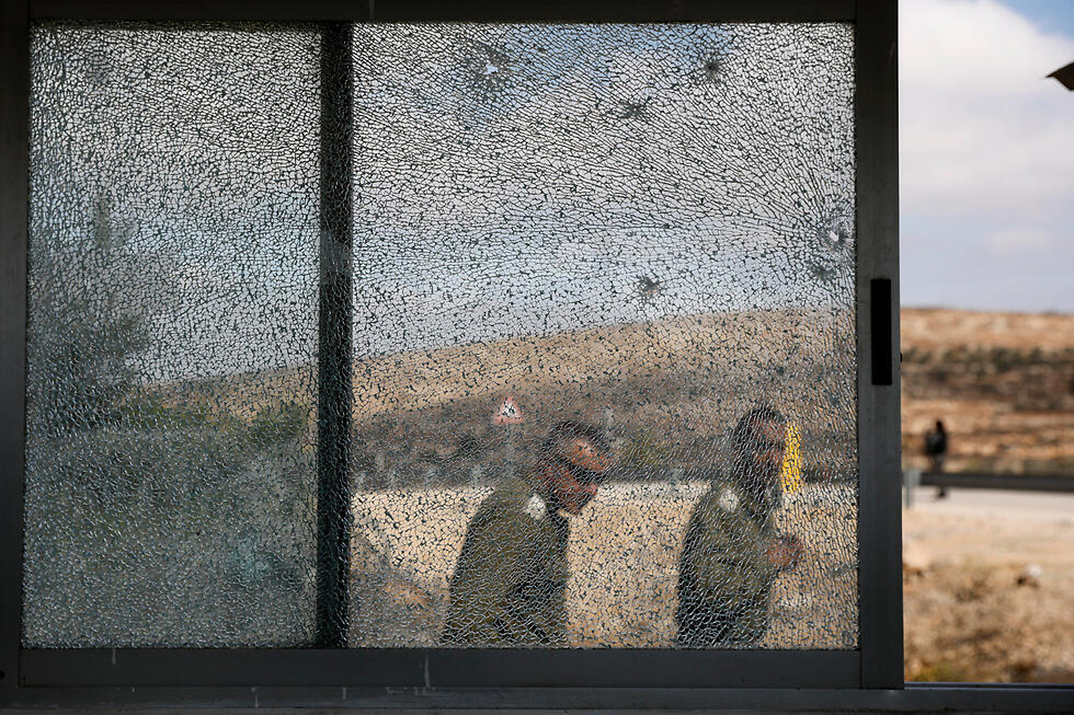 Scenes of the Har Adar attack (Photo: EPA)