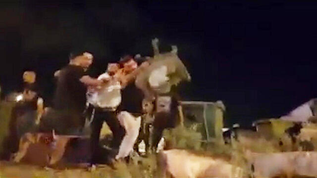 An attacker throwing a chair at an animal rights activist