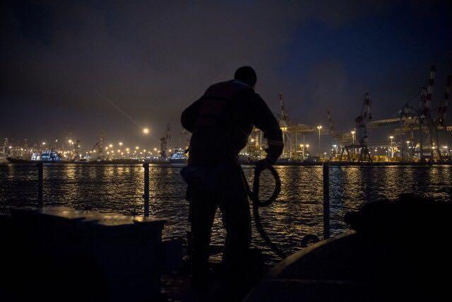 A crewman aboard a Navy ship across from the port of Ashdod