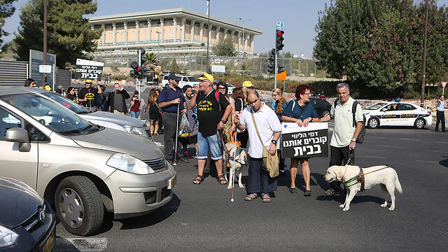 Blind protesters were also on hand to demand their transportation benefits be equated to disability benefits