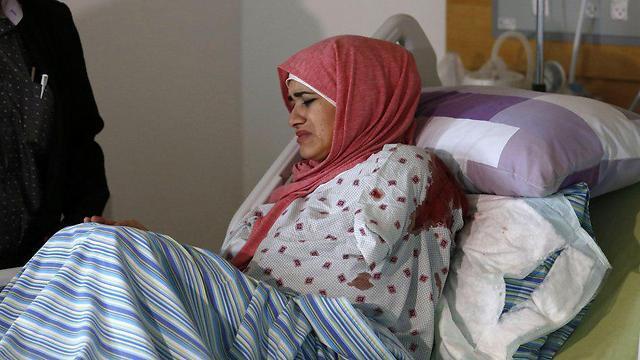 The driver's sister, wounded in the shooting, was taken to a Ramallah hospital (צילום: AFP) The driver's sister, wounded in the shooting, was taken to a Ramallah hospital