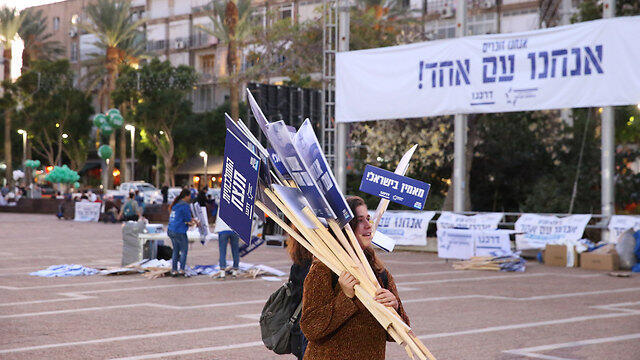 Preparations for the rally, featuring rally's banner: 'Remember - We are one people!'