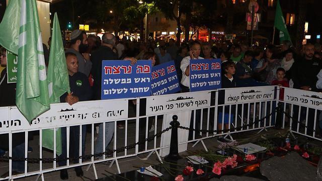 Banners by the Rabin monument stating 'Here was murdered a prime minister who strove for peace'