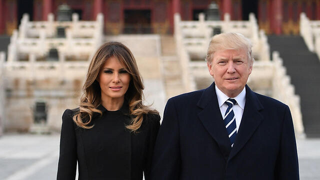 Мелания и Дональд Трамп в Китае. Фото: AFP