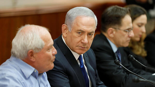 Prime Minister Benjamin Netanyahu (2nd L) attends the weekly cabinet meeting at his office in Jerusalem November 12, 2017