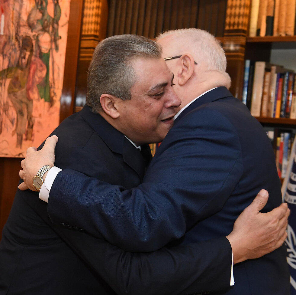 Khairat (L) and Rivlin embrace
