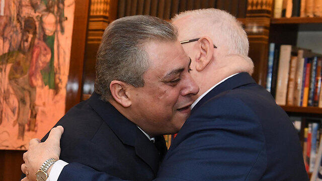 Khairat (L) and Rivlin embrace
