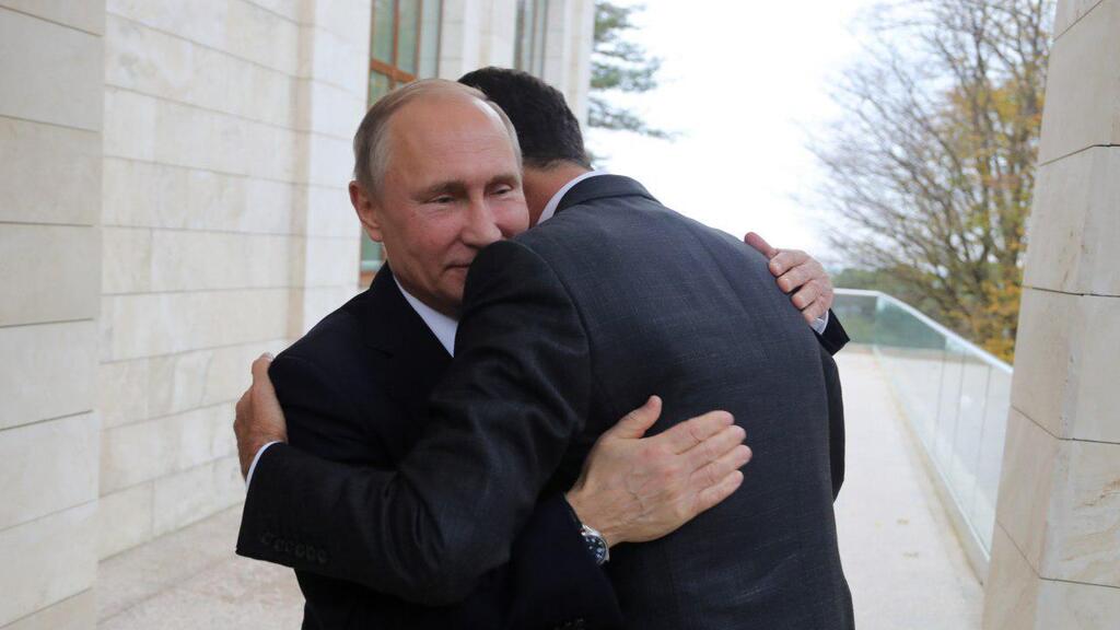 Vladimir Putin embraces Bashar al-Assad 