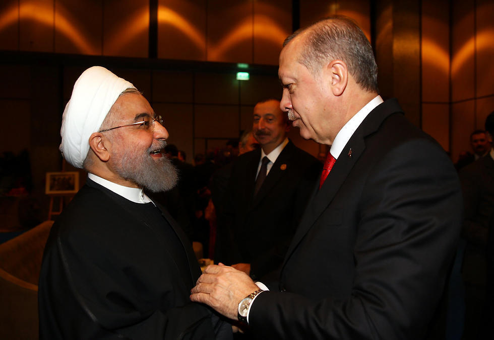 Erdogan, right, welcomes Rouhani