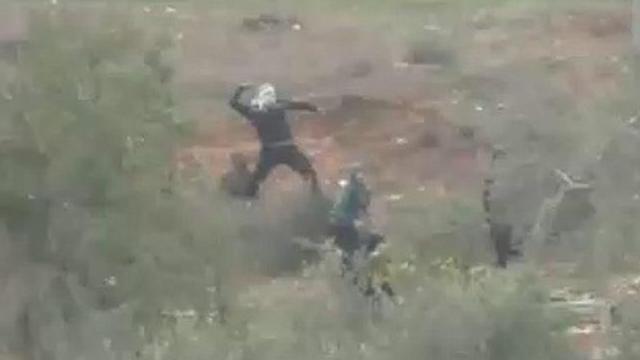 Settlers throwing stones in Burin, Nablus