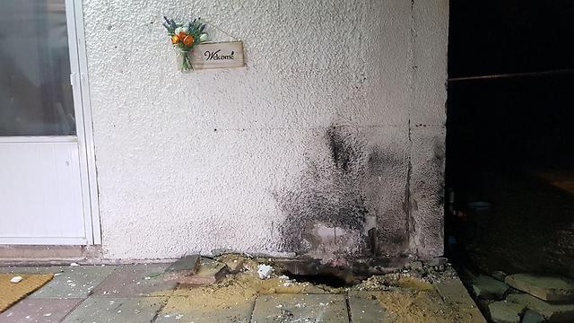 A rocket landing near a home in Hof Ashkelon Sunday evening