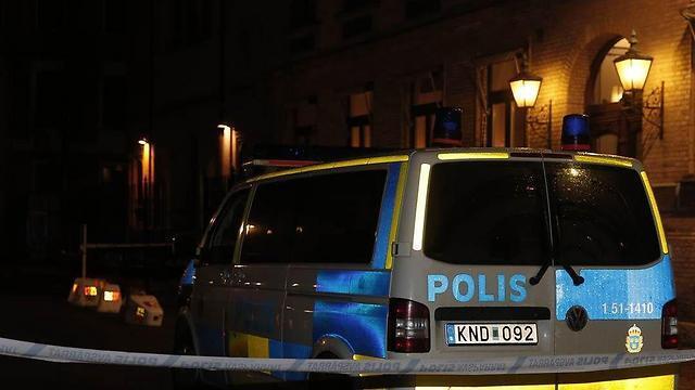 Swedish police at the scene of the arson attack