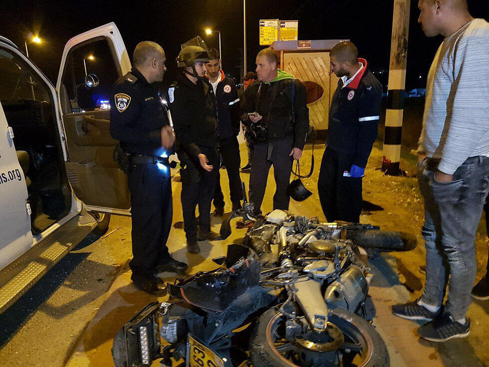 Nechushtan (center) and his destroyed bike