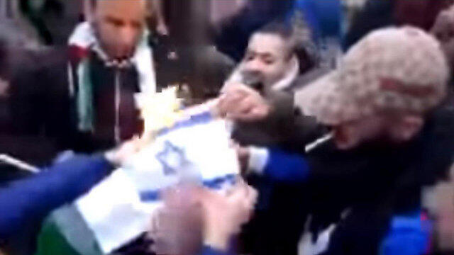 An Israeli flag being burned in a Stuttgart demonstration