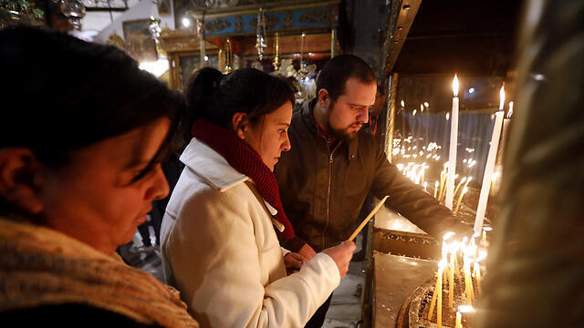 Candlelight Christmas Eve service in Bethlehem (צילום: EPA) Candlelight Christmas Eve service in Bethlehem