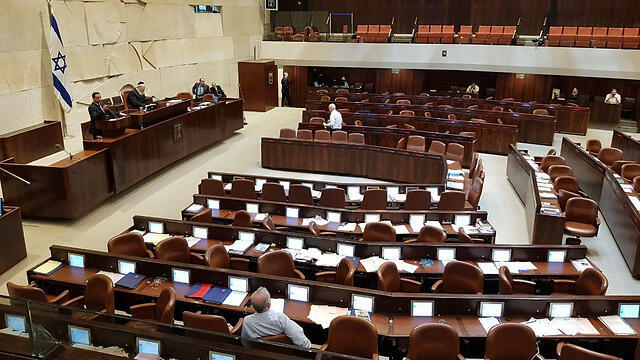Zionist Union MK Yoel Hasson speaking to an almost empty plenum