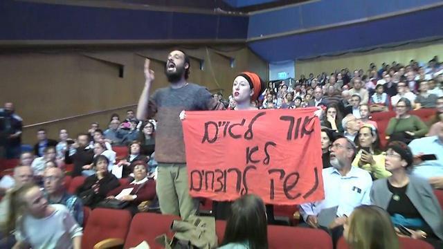 Activists heckle the prime minister