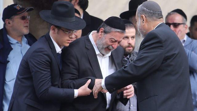 Aliza's father at thr funeral