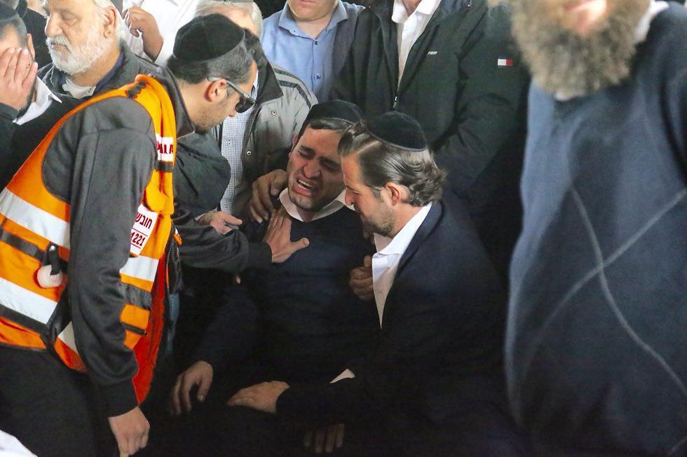 Aliza's brother at the funeral