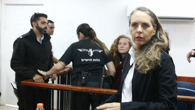 Tamimi (background) and her attorney Gaby Lasky in court