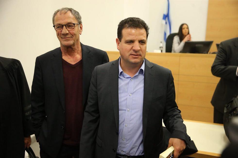 Mohammad Bakri, left, with Joint List leader Ayman Odeh in court