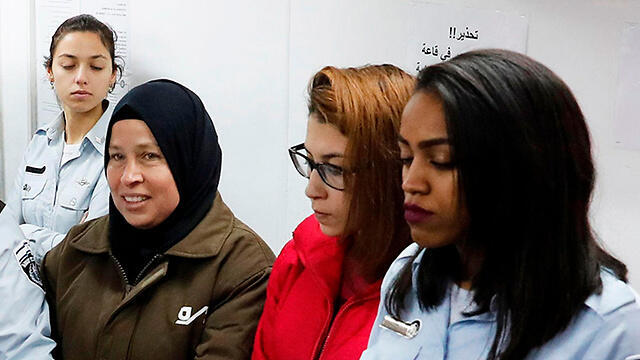 Neriman Tamimi, in brown, and Nur Tamimi, in red