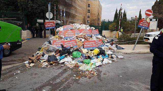 Garbage piled outside the entrance to the Finance Ministry's Jerusalem offices