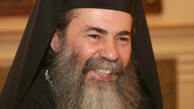 The motorcade of Greek Orthodox Patriarch Theophilos III was pelted with rocks by Palestinians protesting his church's sale of lands to Israelis