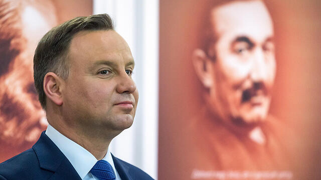 President Duda said the law will preserve Poland's 'dignity and historical truth' (צילום: EPA) President Duda said the law will preserve Poland's 'dignity and historical truth'