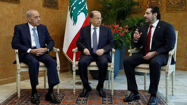 Lebanese President Michel Aoun (center) with Prime Minister Saad al-Hariri (R) and Parliament Speaker Nabih Berri 